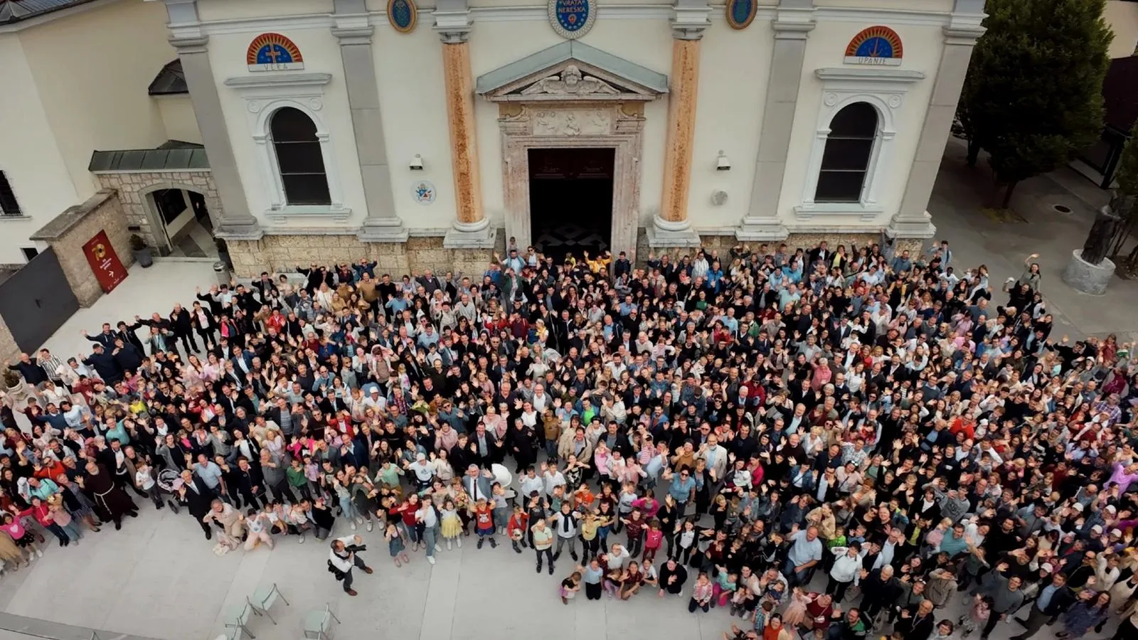 Aerial view of more than 1,000 people gathered in front of the basilica at Brezje, Slovenia